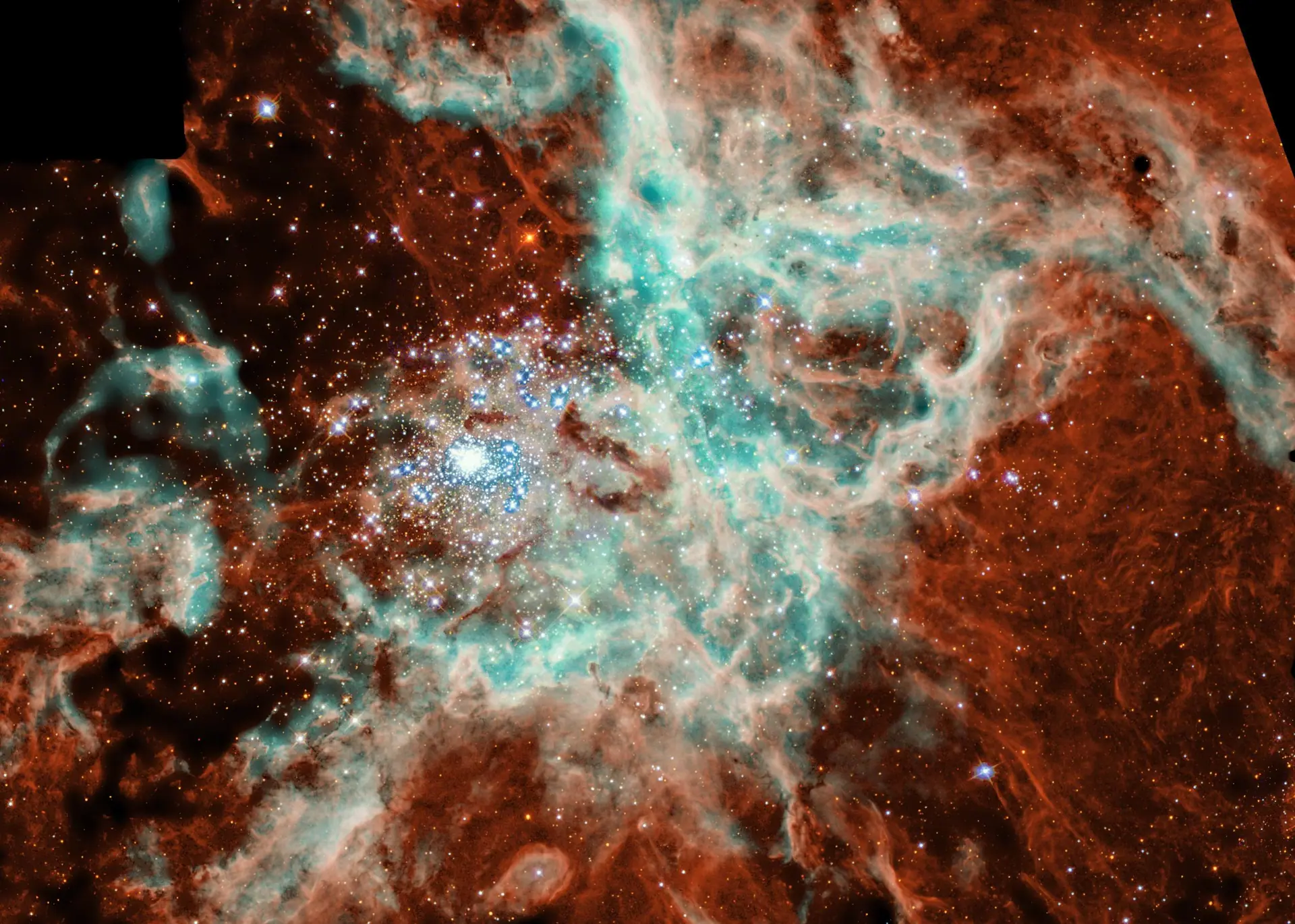 Doradus Nebula. Credit: NASA, N. Walborn and J. Maiz-Apellaniz (Space Telescope Science Institute), R. Barba (La Plata Observatory, La Plata, Argentina). NASA media guidelines (public domain). A vast sculpted area of gas and dust where thousands of stars are being born, seen by Hubble
