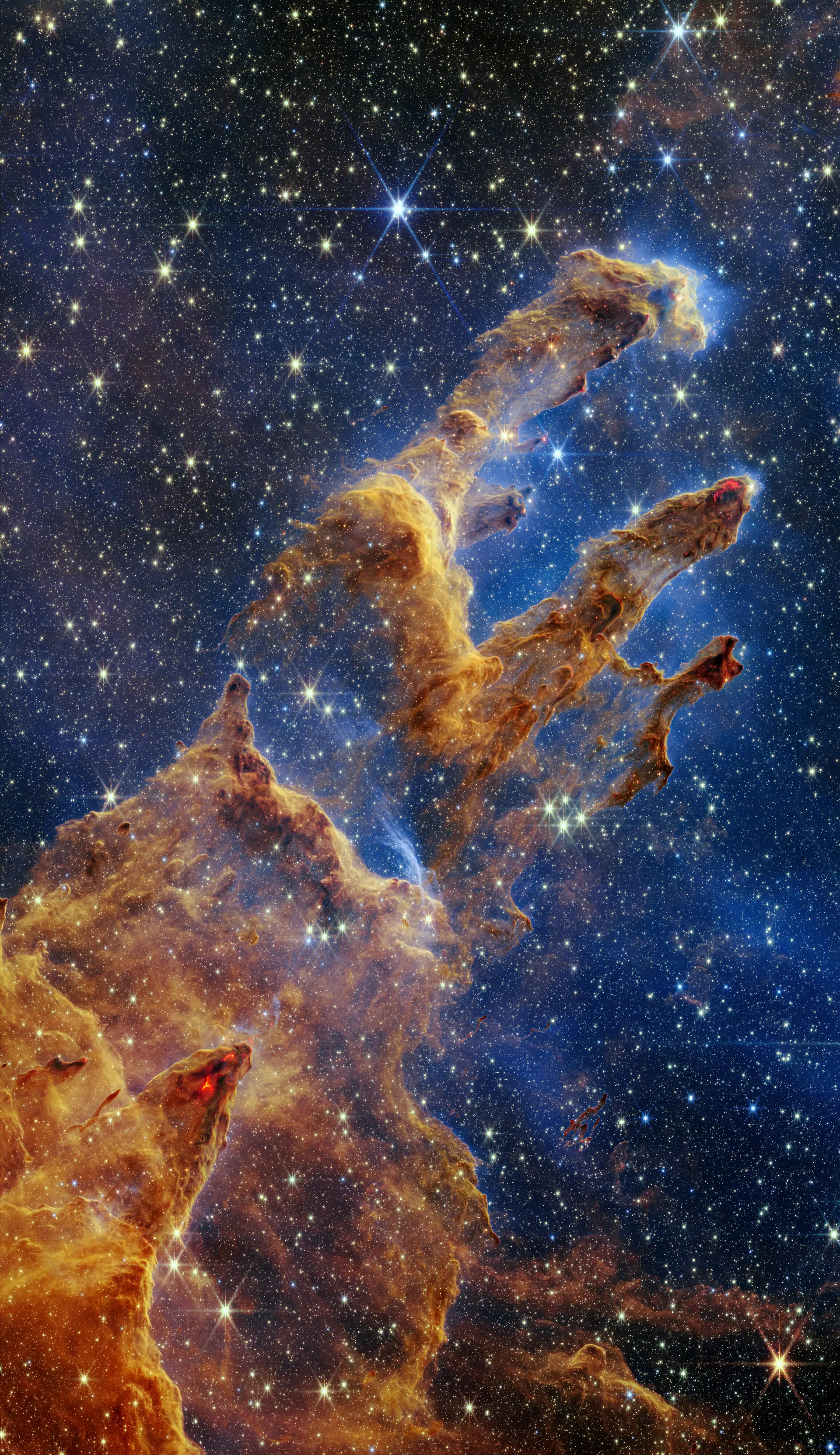 Pillars of Creation (Webb, full view). Credit: NASA, ESA, CSA, STScI; J. DePasquale, A. Koekemoer, A. Pagan (STScI). CC BY 4.0. Webb's star-filled view of the Pillars of Creation, towers of gas and dust threaded with red dots of new stars